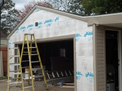 garage siding under repair